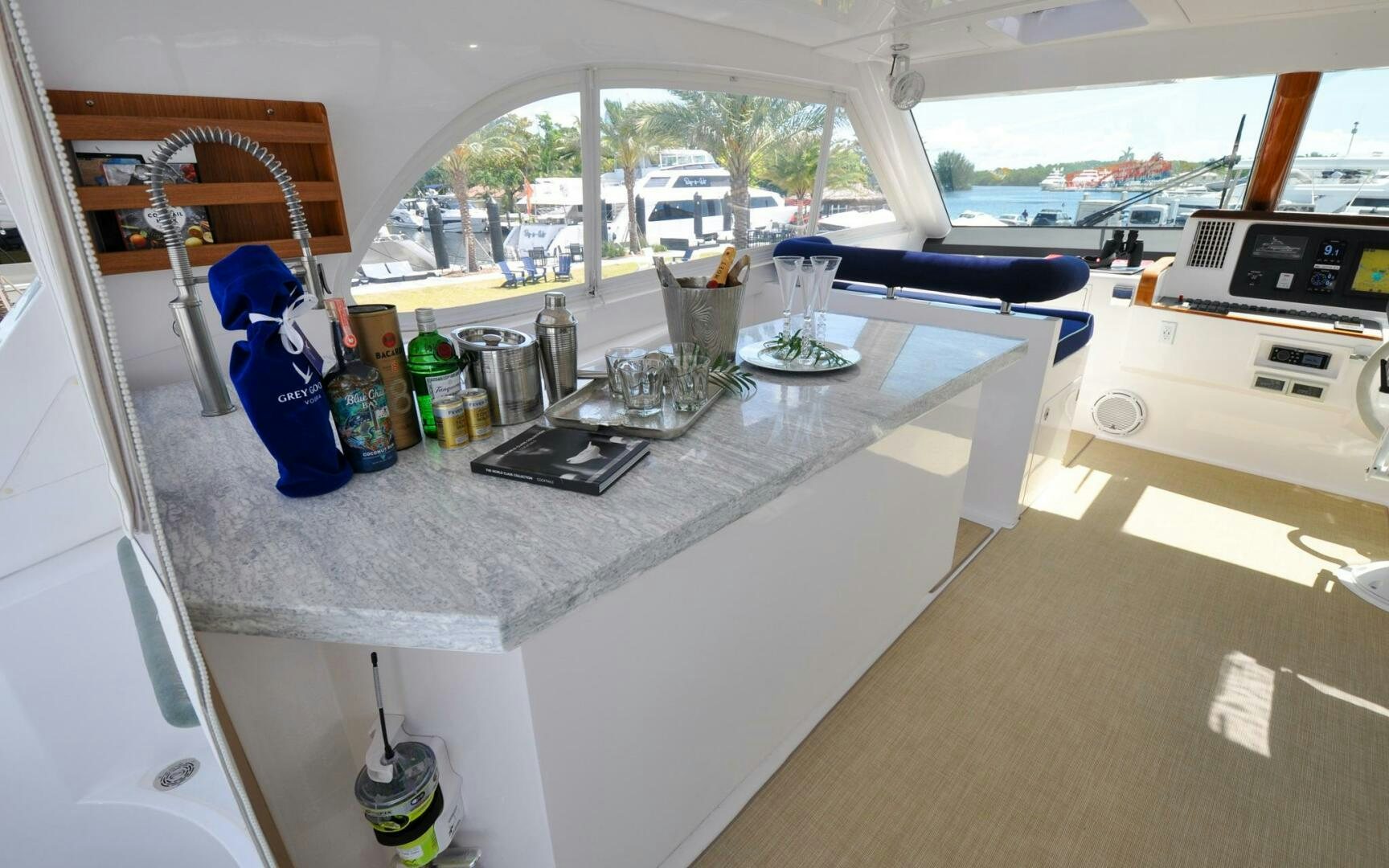 a kitchen with a table and a laptop on it aboard CASTINA Yacht for Sale