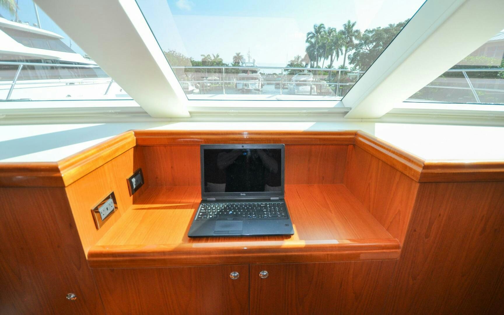 a laptop on a desk aboard CASTINA Yacht for Sale