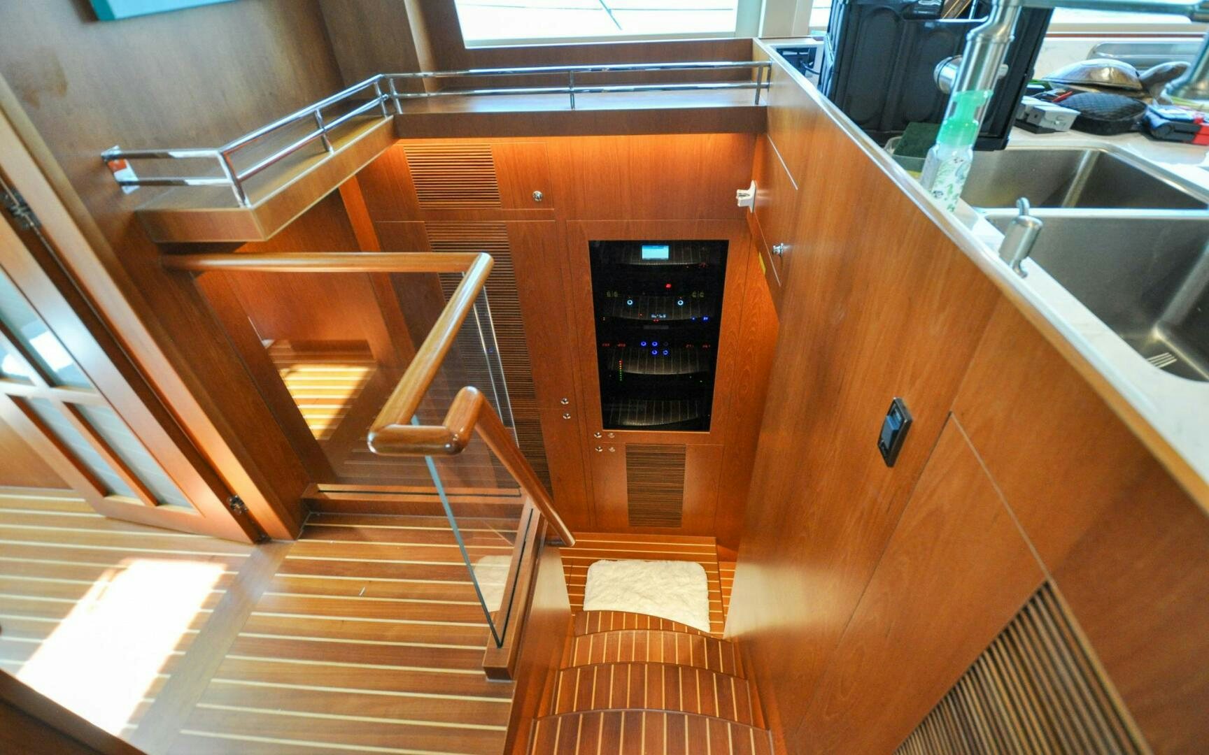a wooden staircase in a room aboard CASTINA Yacht for Sale
