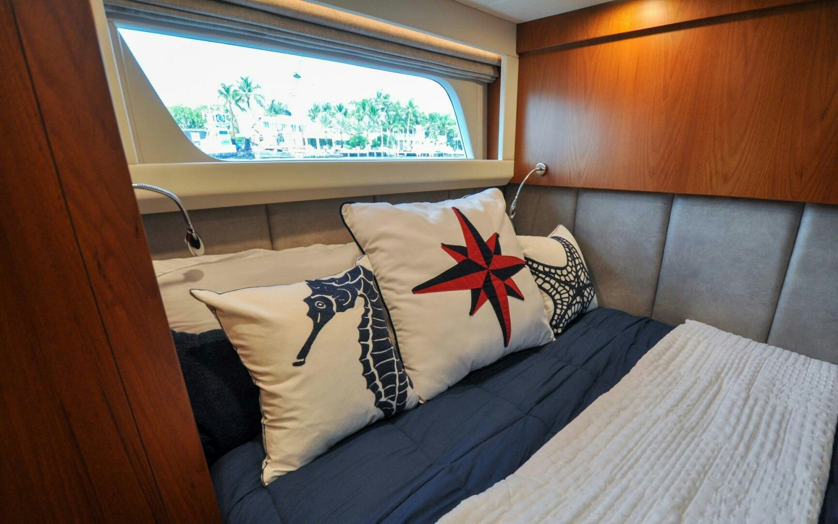 a bed with pillows aboard CASTINA Yacht for Sale