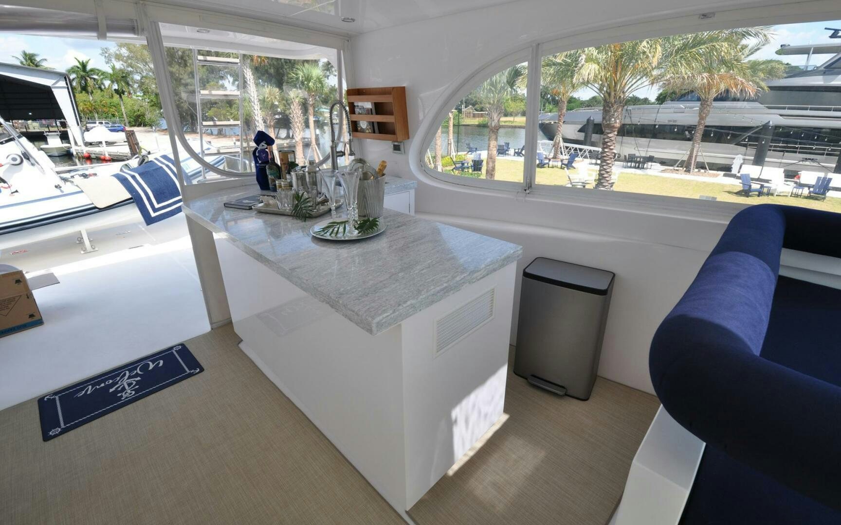 a room with a table and chairs aboard CASTINA Yacht for Sale