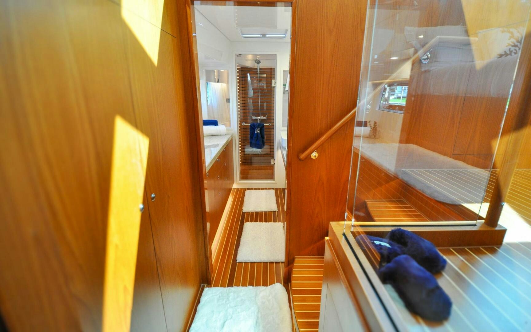 a room with a door and a bed aboard CASTINA Yacht for Sale