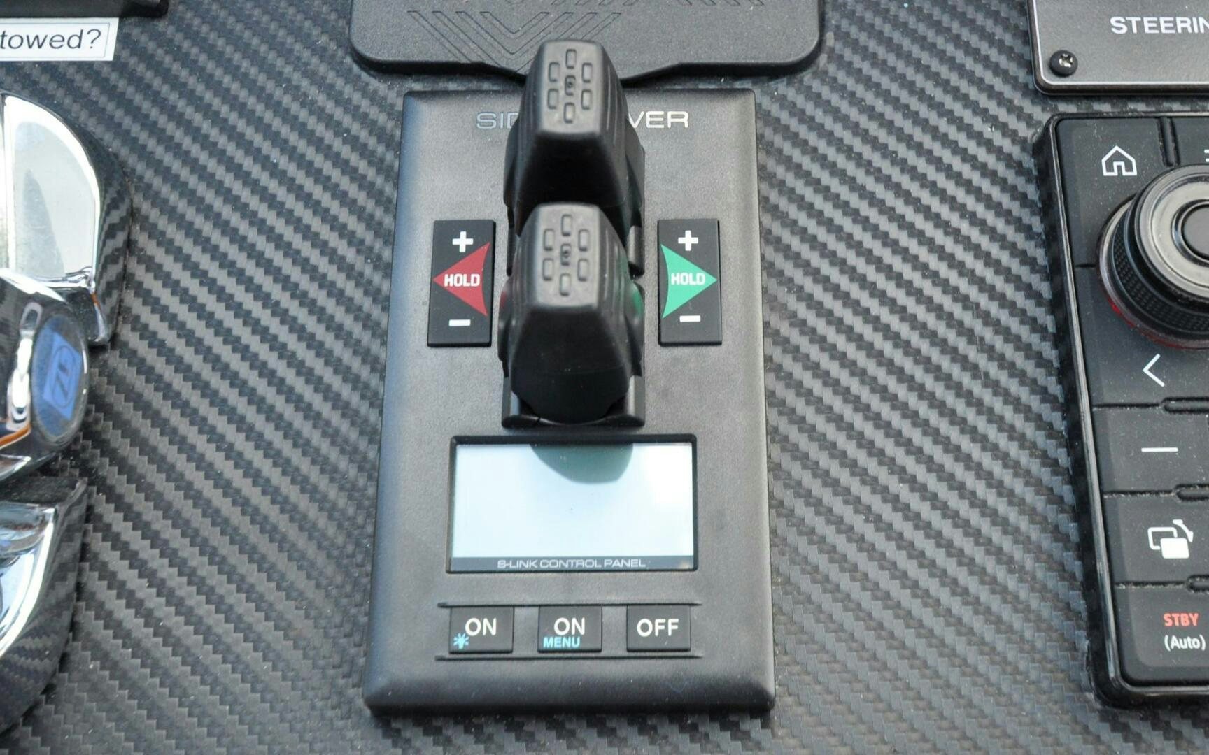 a black car with a cell phone on it aboard CASTINA Yacht for Sale