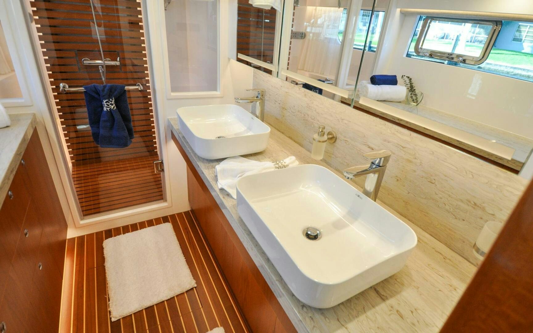 a bathroom with a sink and a mirror aboard CASTINA Yacht for Sale