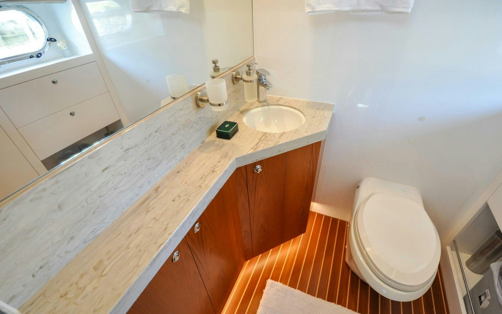 a bathroom with a sink and a toilet aboard CASTINA Yacht for Sale