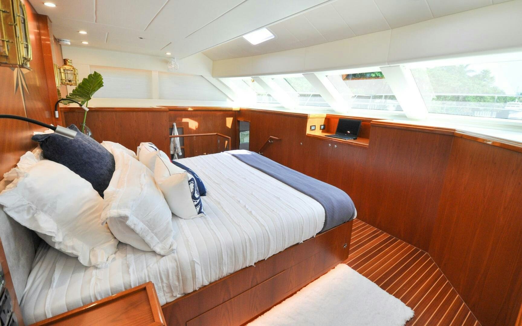 a bed with white sheets aboard CASTINA Yacht for Sale