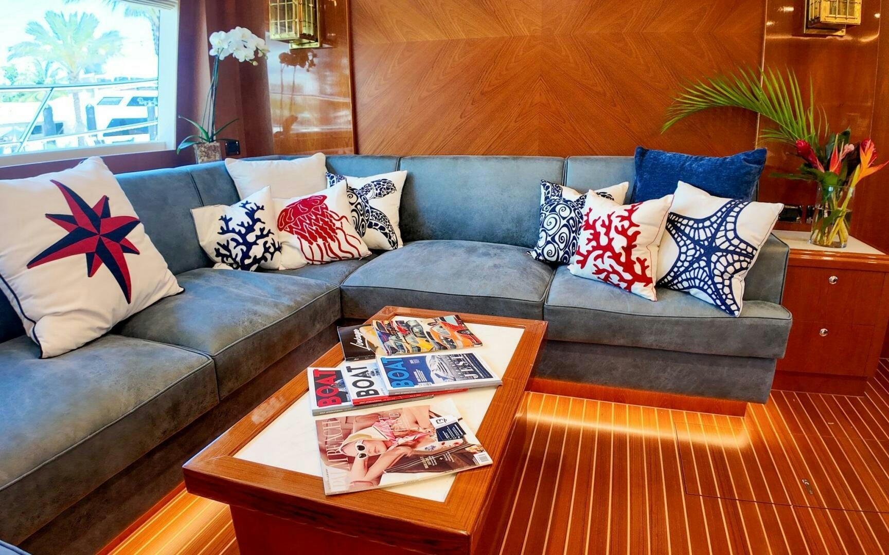 a couch with pillows and pillows aboard CASTINA Yacht for Sale