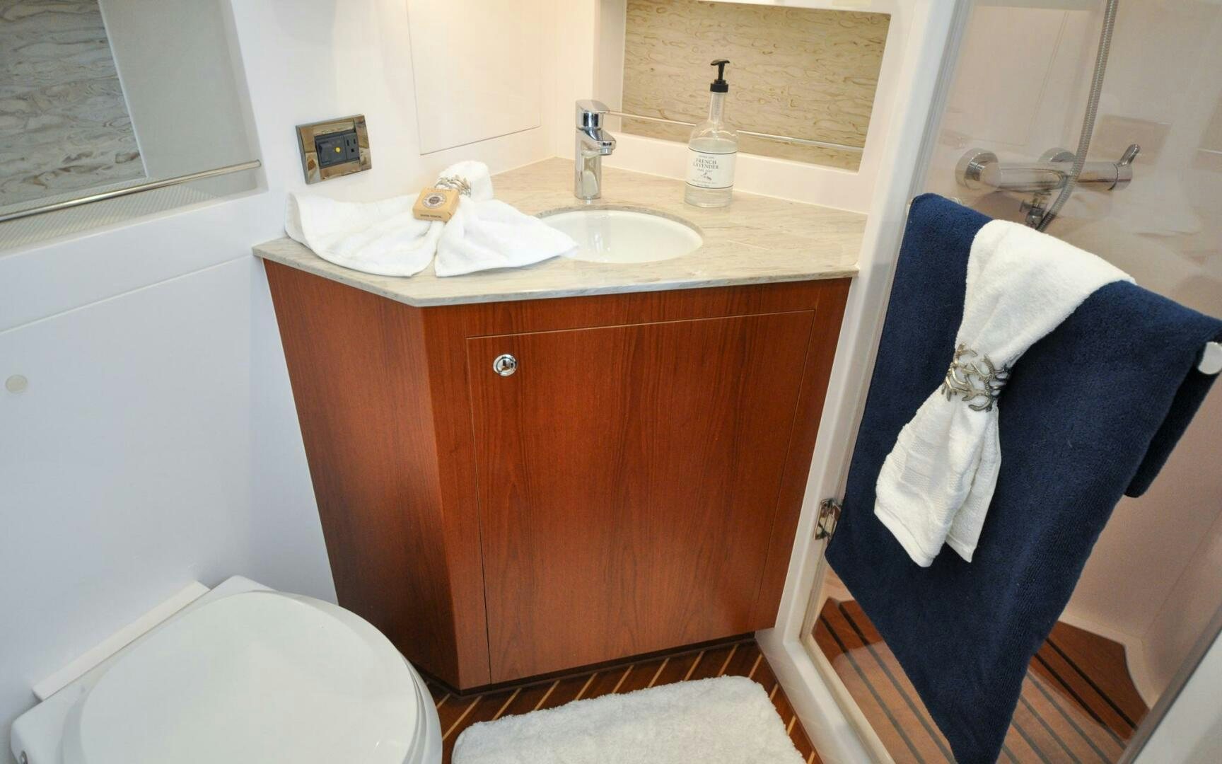 a bathroom with a sink and a toilet aboard CASTINA Yacht for Sale