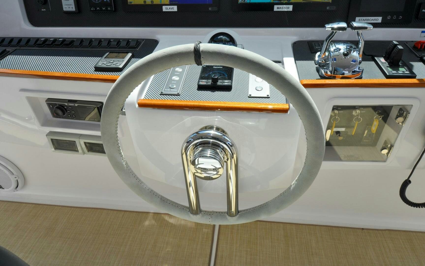 a white car with a yellow hood aboard CASTINA Yacht for Sale