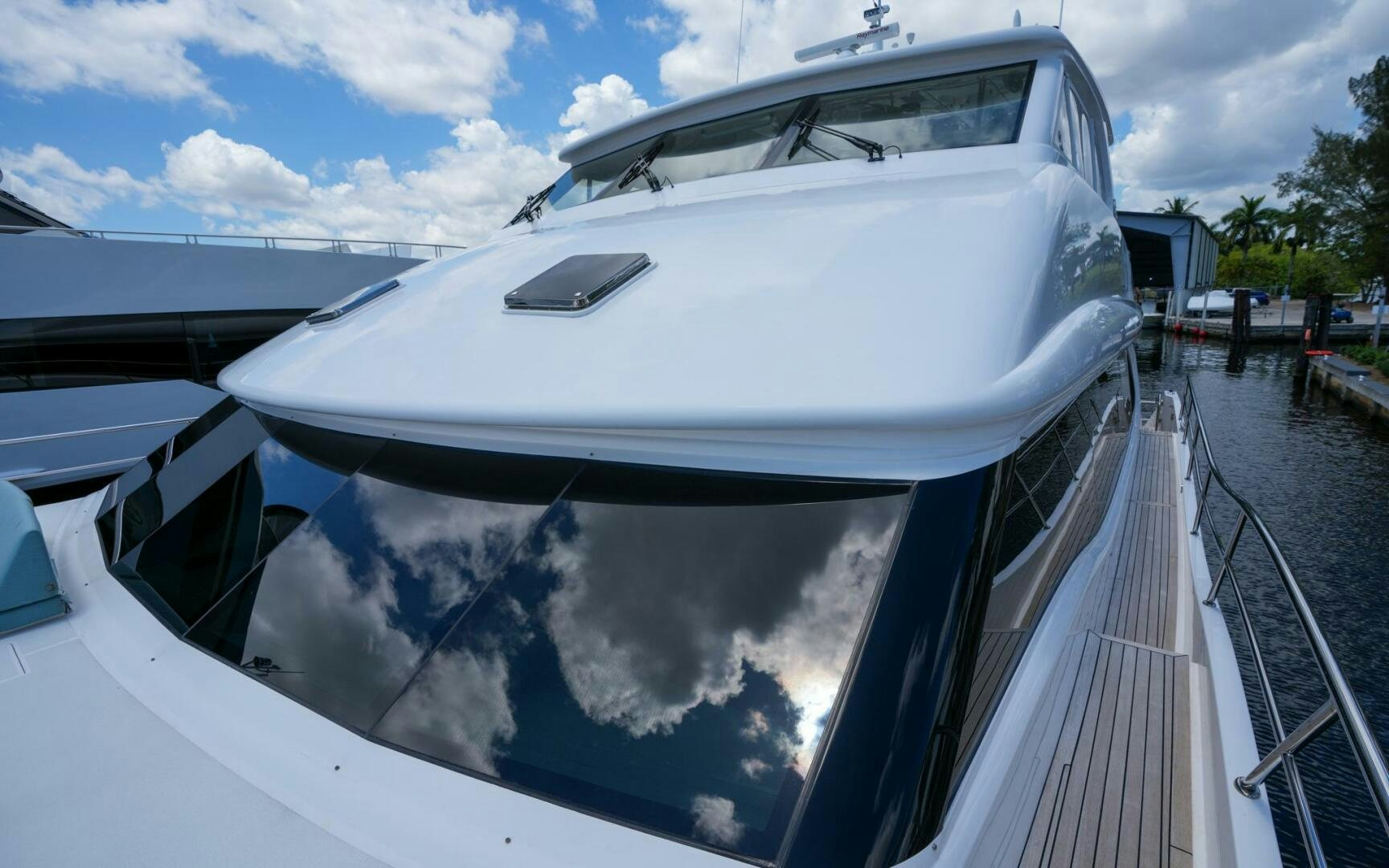 a white boat parked on a dock aboard CASTINA Yacht for Sale
