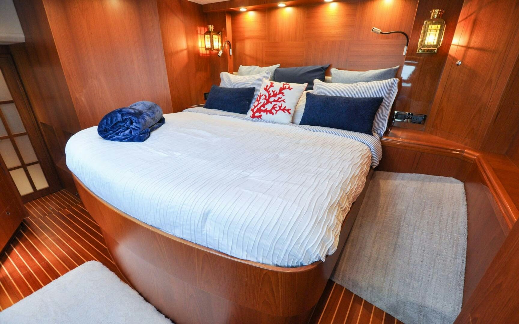 a bed with pillows aboard CASTINA Yacht for Sale