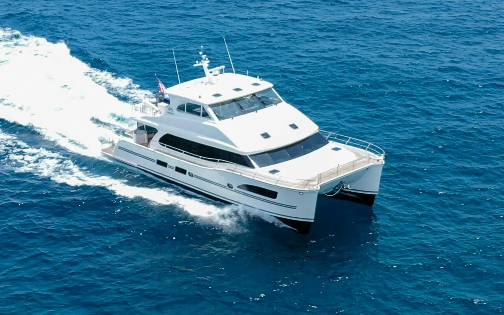 a white yacht on the water aboard CASTINA Yacht for Sale