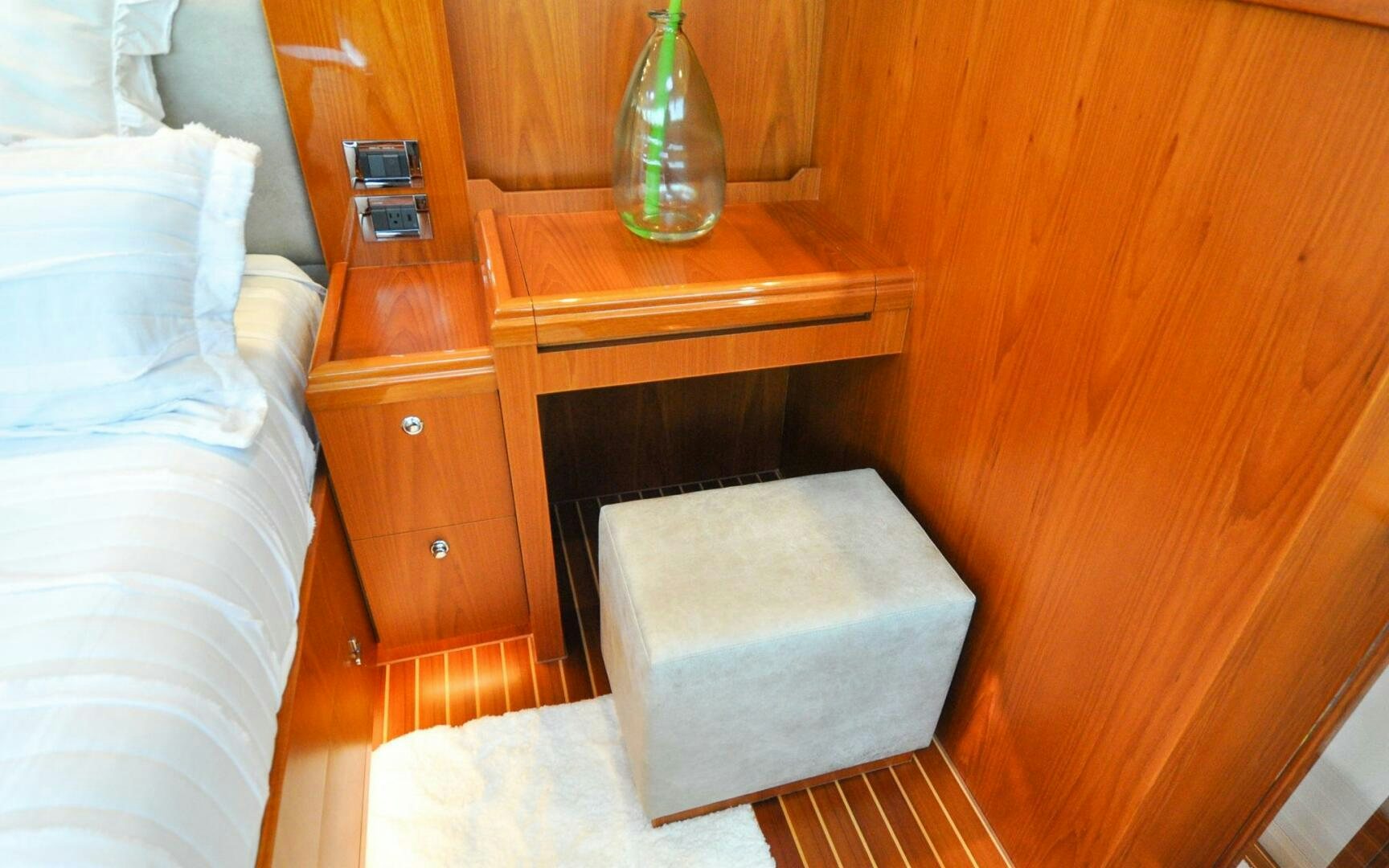 a bottle of alcohol on a table aboard CASTINA Yacht for Sale