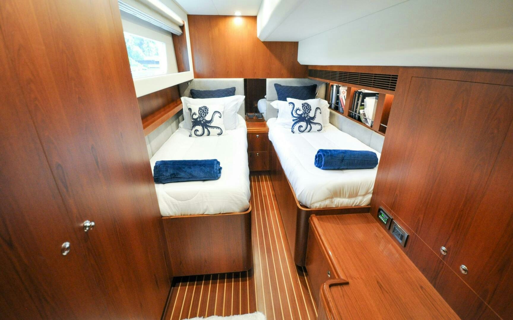 a room with two beds aboard CASTINA Yacht for Sale