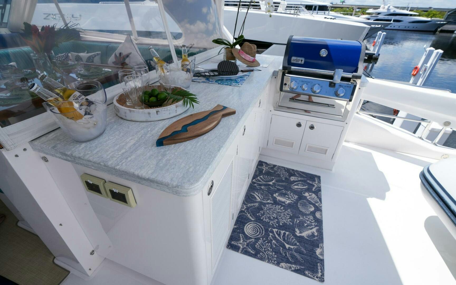 a kitchen with a white counter top aboard CASTINA Yacht for Sale