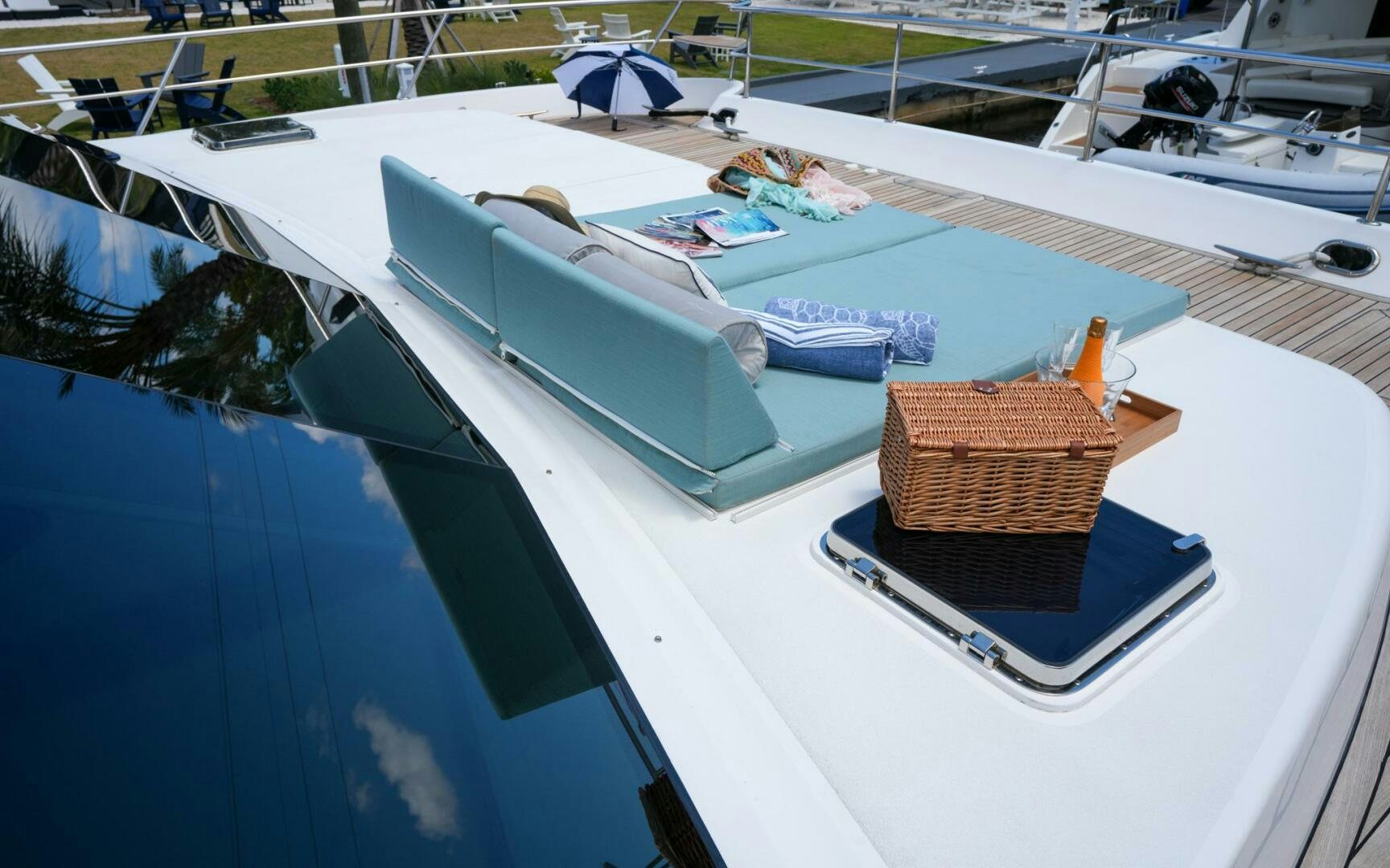 a pool with a basket and umbrellas aboard CASTINA Yacht for Sale
