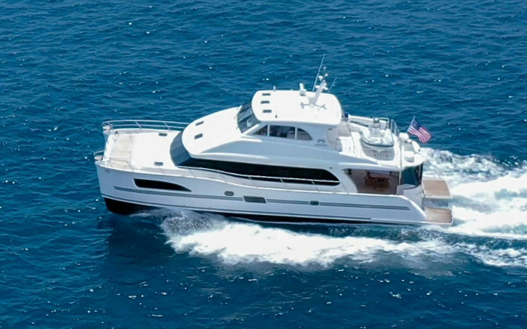 a white yacht on the water aboard CASTINA Yacht for Sale