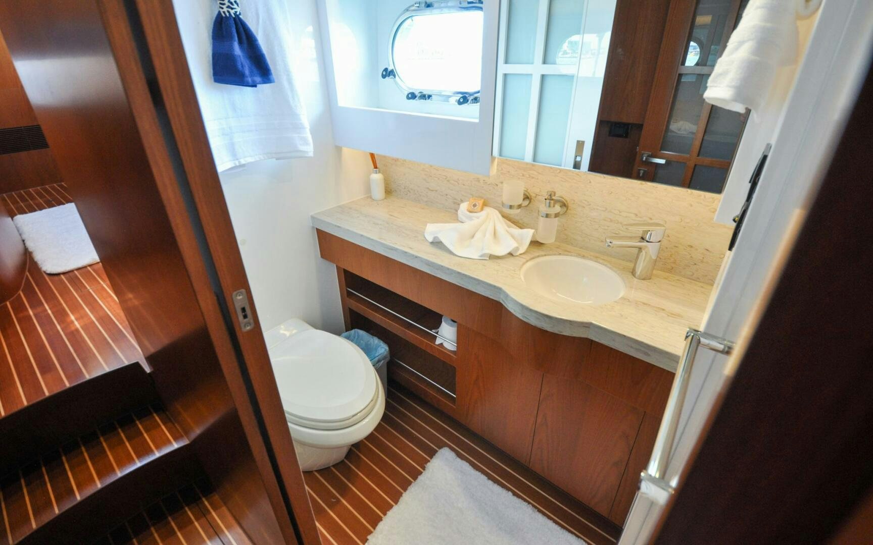 a bathroom with a sink toilet and a bathtub aboard CASTINA Yacht for Sale