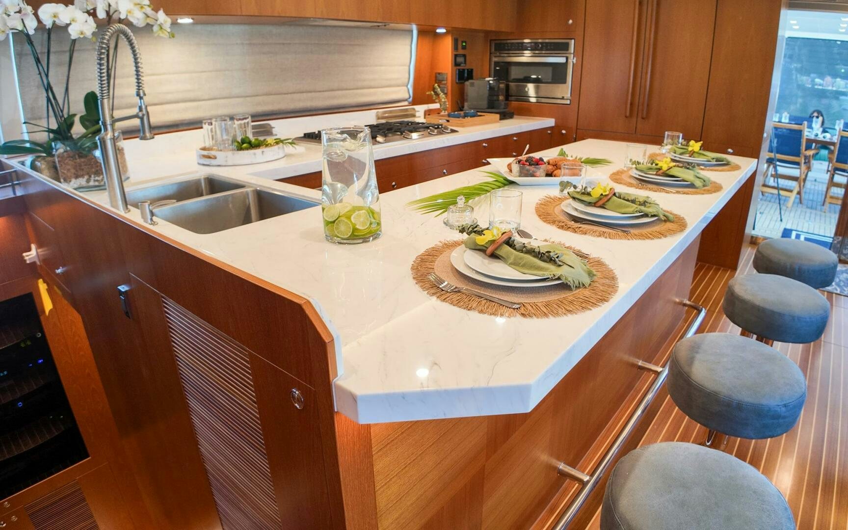 a kitchen with a table set aboard CASTINA Yacht for Sale