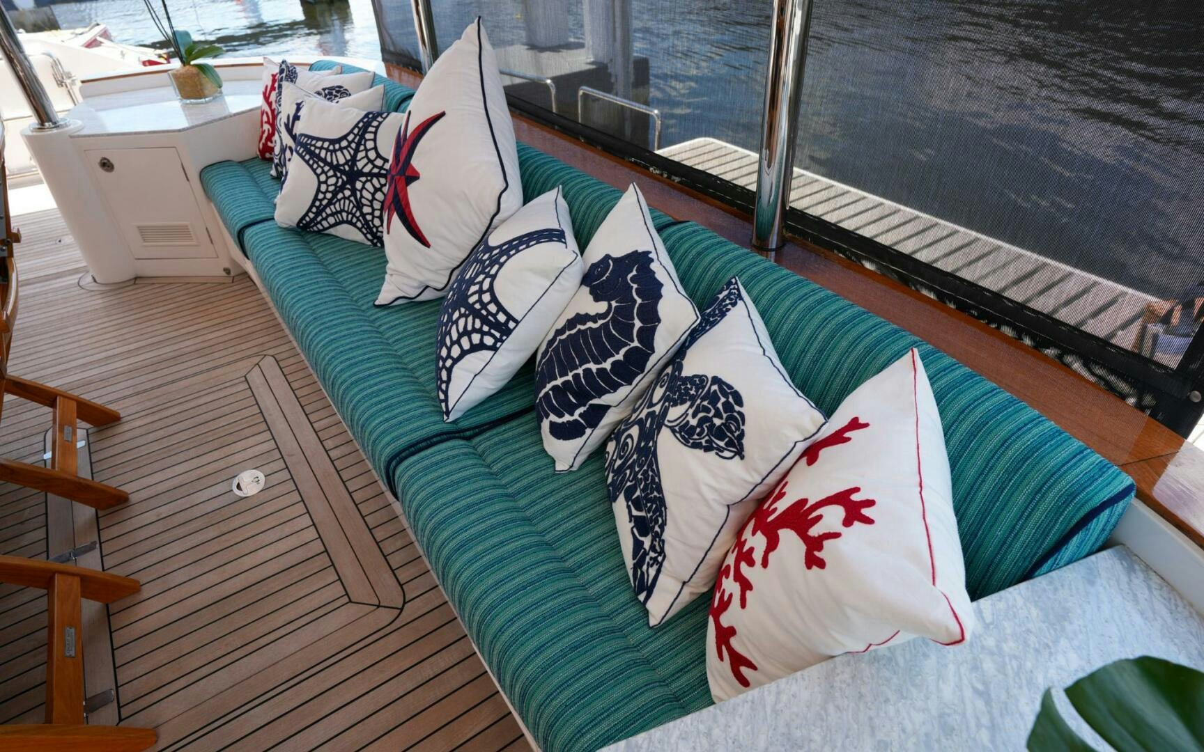 a bed with pillows on it aboard CASTINA Yacht for Sale