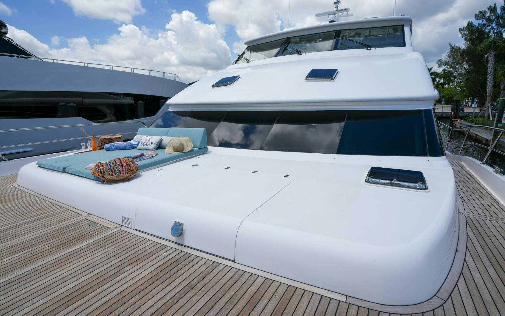 a white boat on a deck aboard CASTINA Yacht for Sale