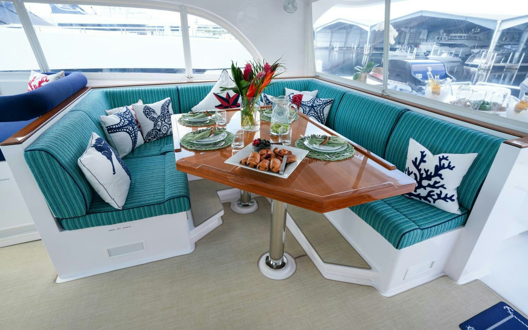 a table with food on it aboard CASTINA Yacht for Sale