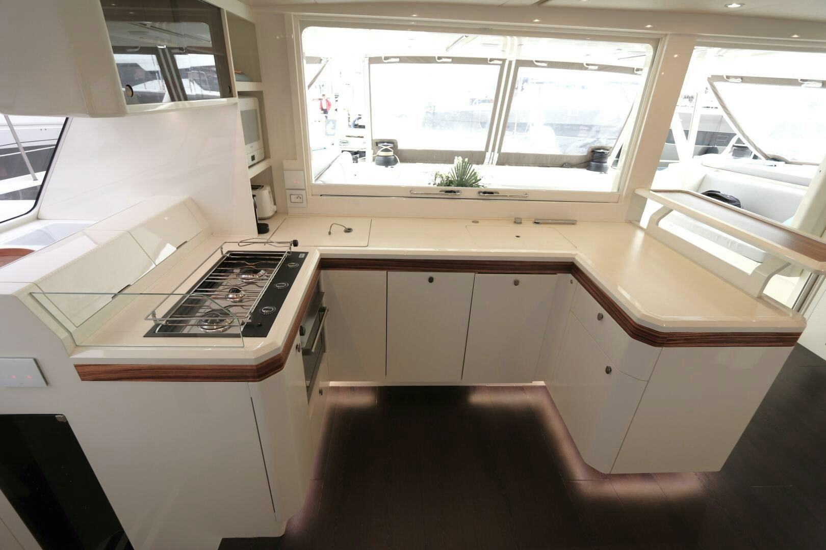 a room with a window and a desk with a computer on it aboard CATCH ME Yacht for Sale
