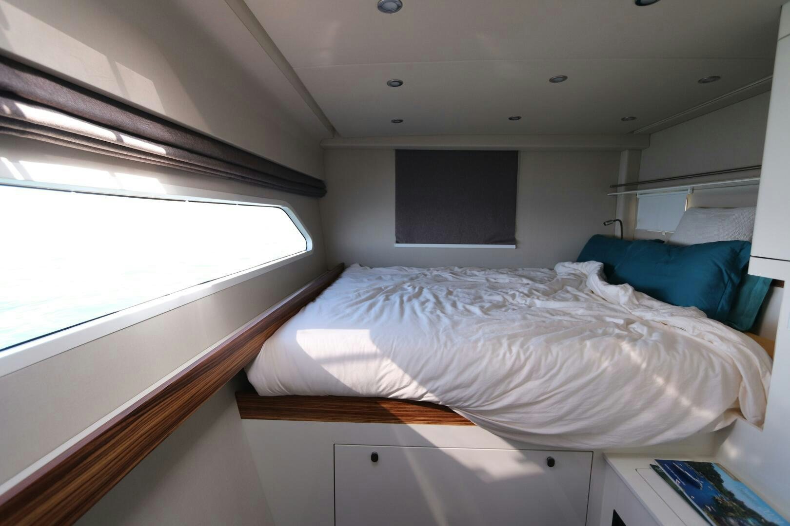 a room with a bed and a window aboard CATCH ME Yacht for Sale