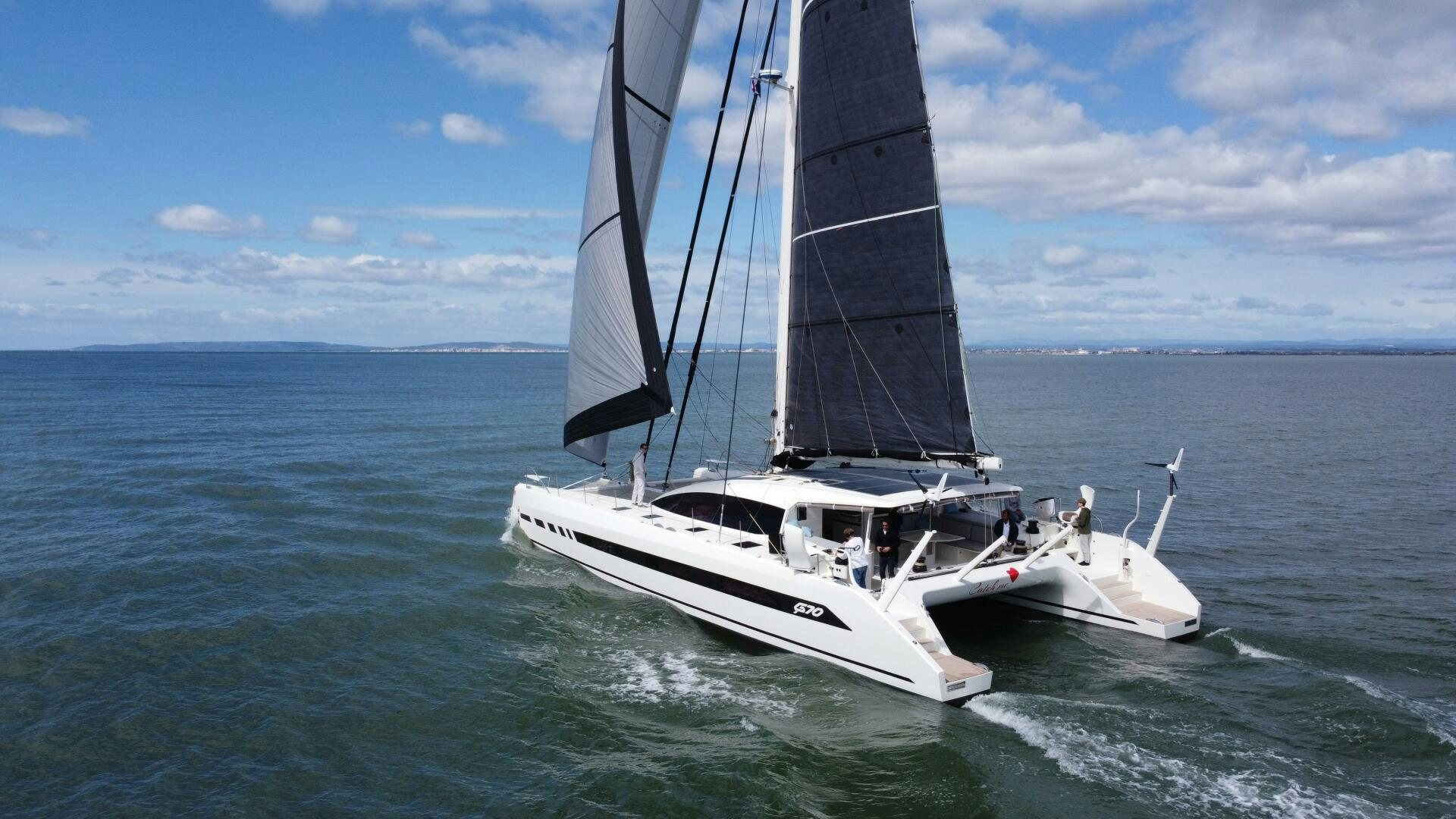 a couple of boats on the water aboard CATCH ME Yacht for Sale