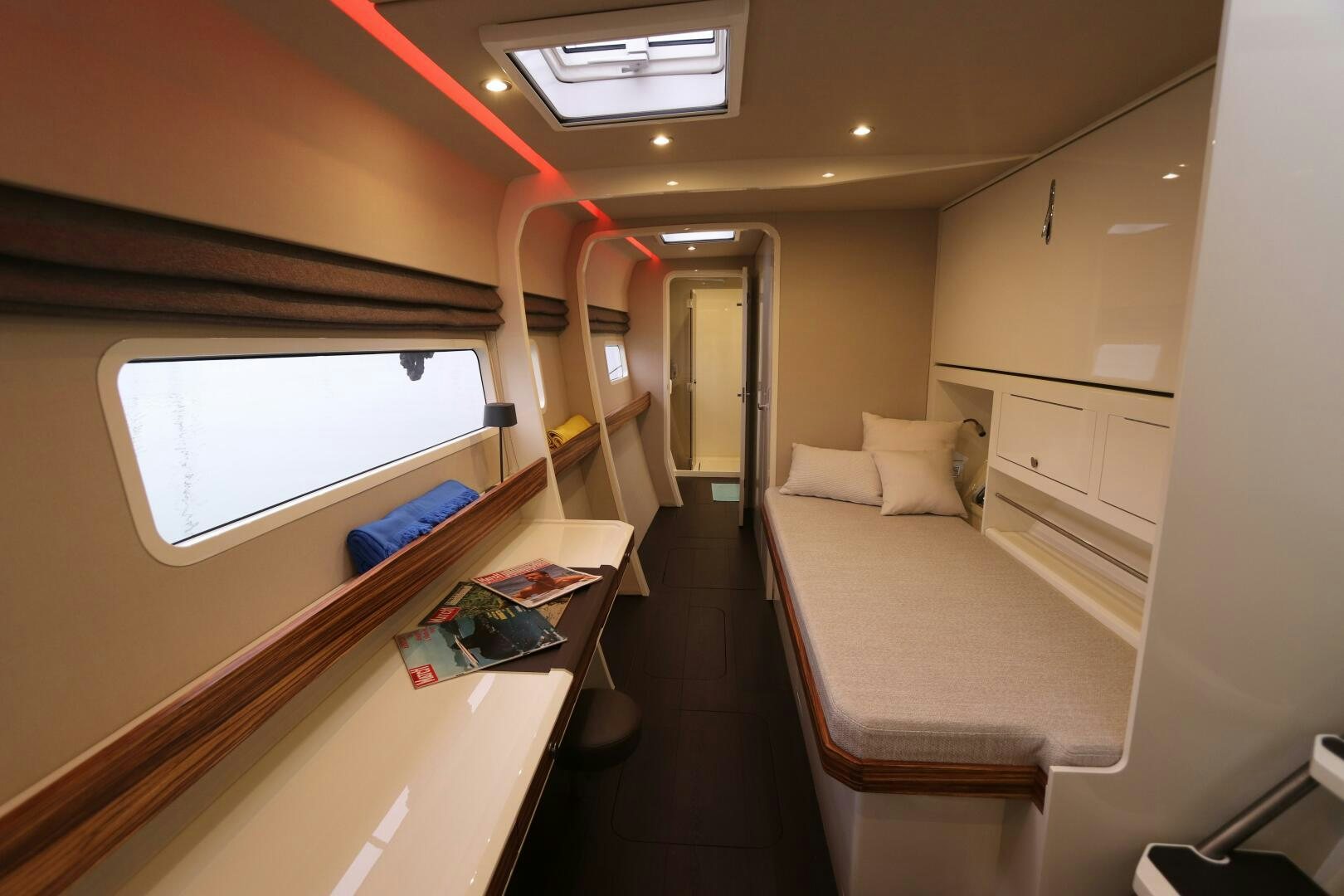 a room with a bed and a desk aboard CATCH ME Yacht for Sale