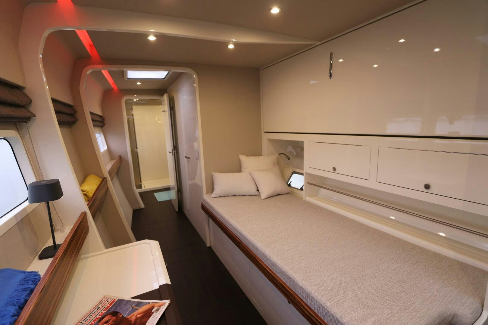 a room with a bed and a desk aboard CATCH ME Yacht for Sale
