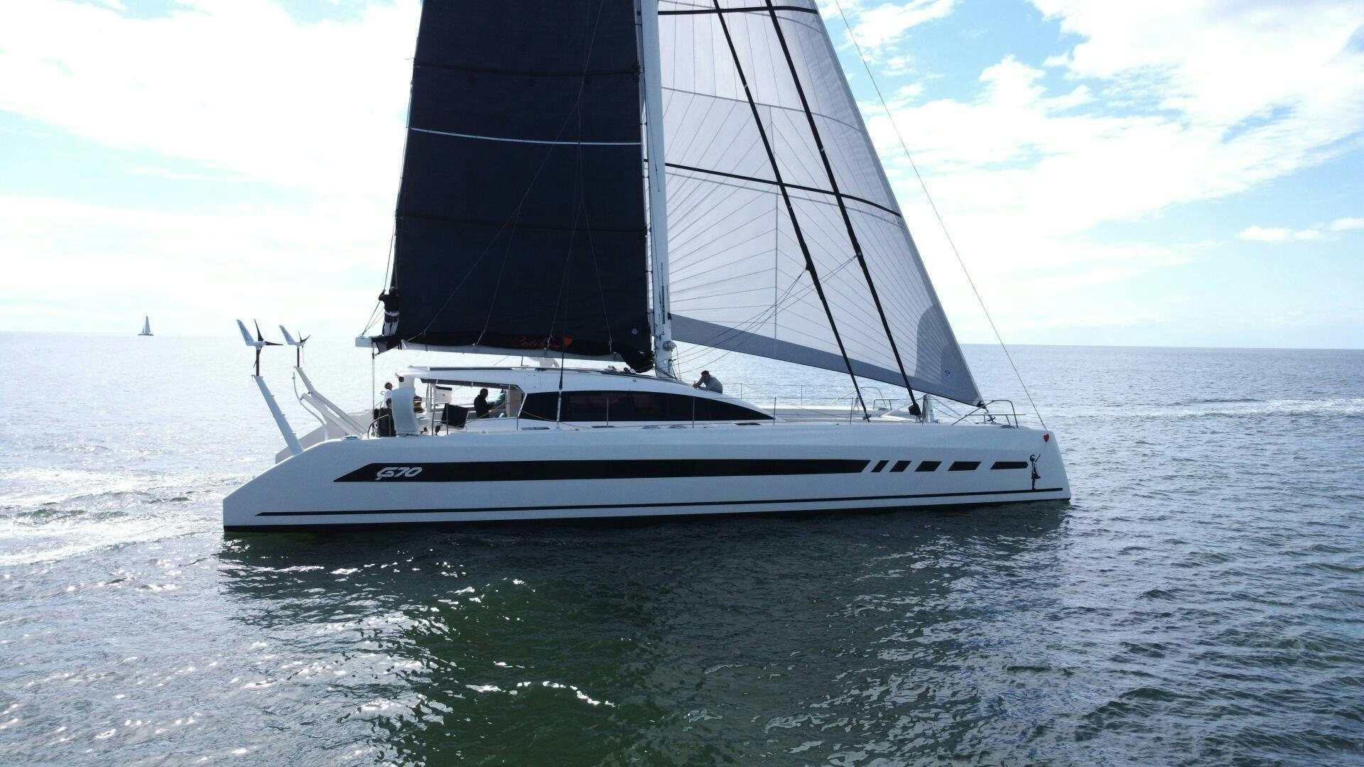 a white boat on the water aboard CATCH ME Yacht for Sale