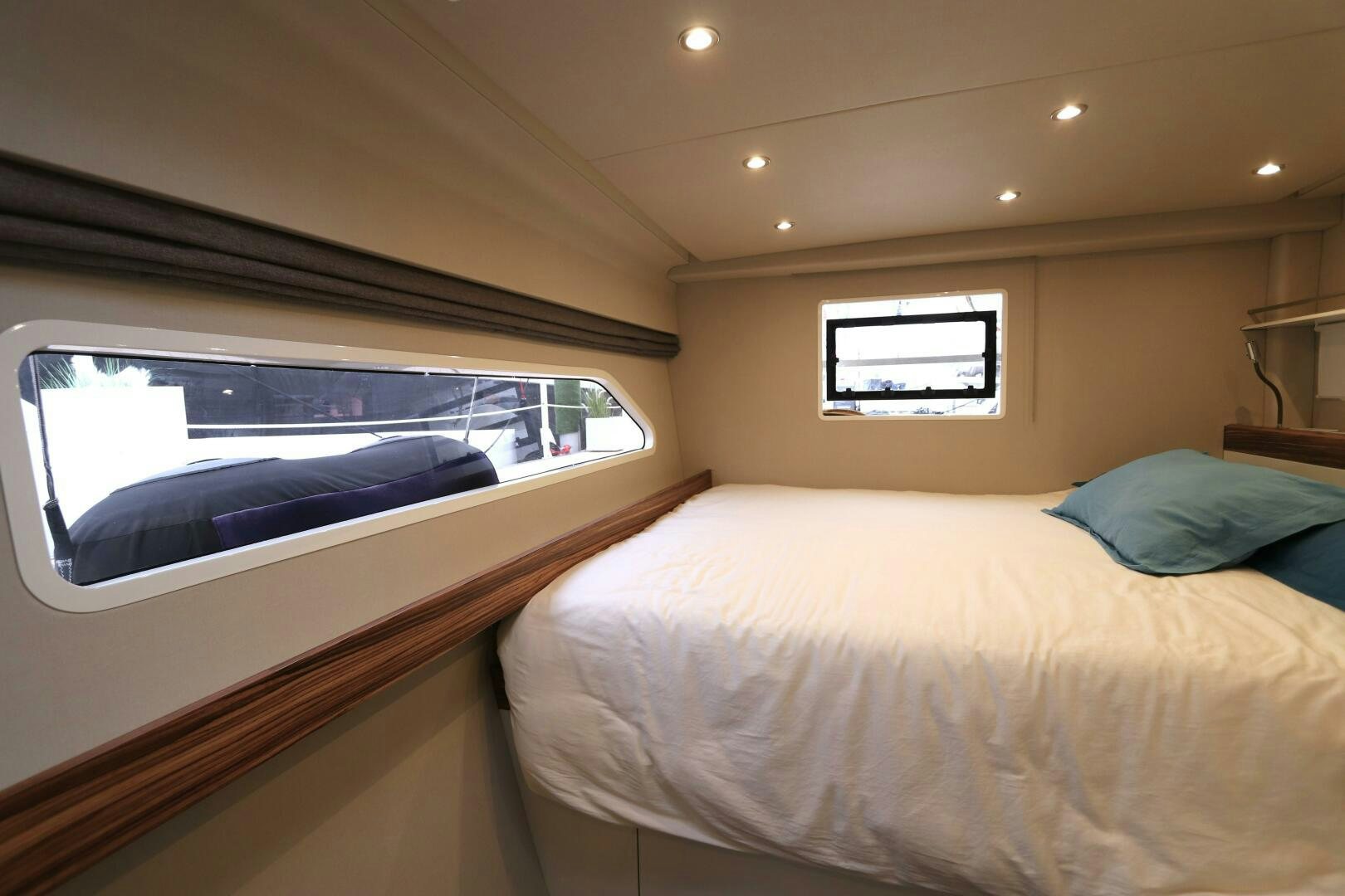 a bed with a large screen aboard CATCH ME Yacht for Sale