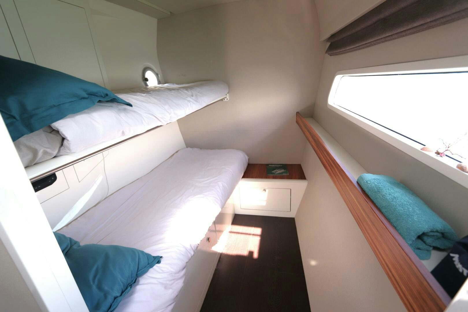 a room with two beds aboard CATCH ME Yacht for Sale