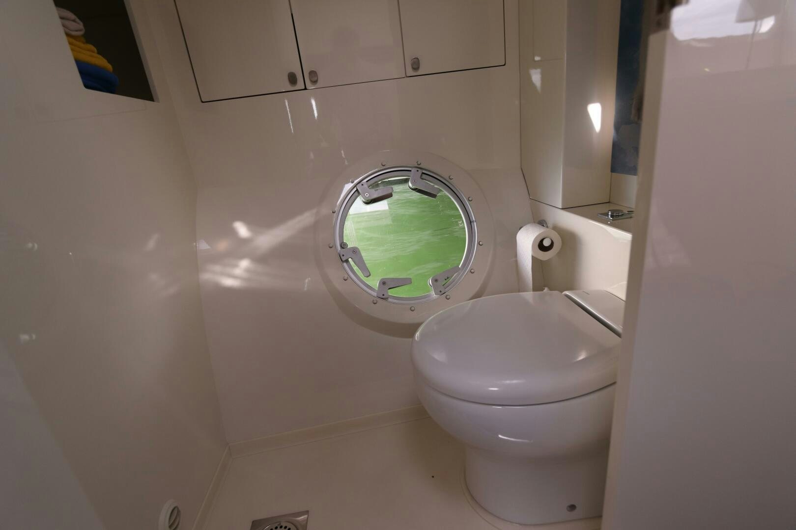 a toilet with a green tank aboard CATCH ME Yacht for Sale