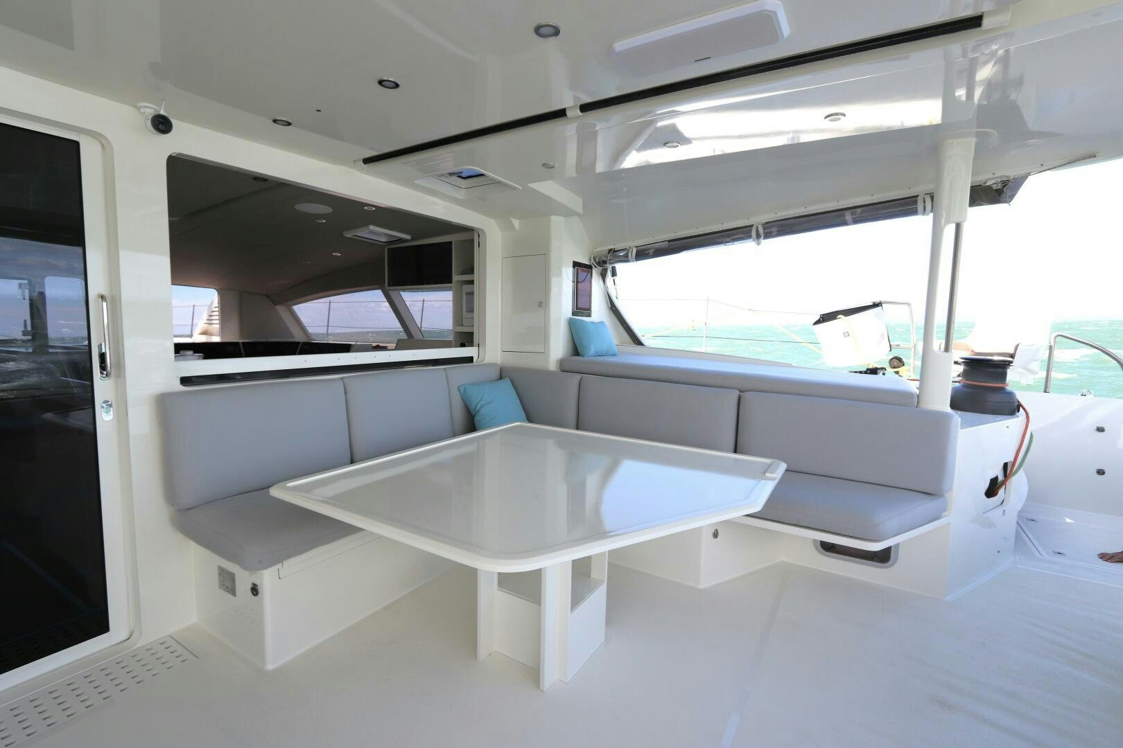 a room with a table and chairs aboard CATCH ME Yacht for Sale