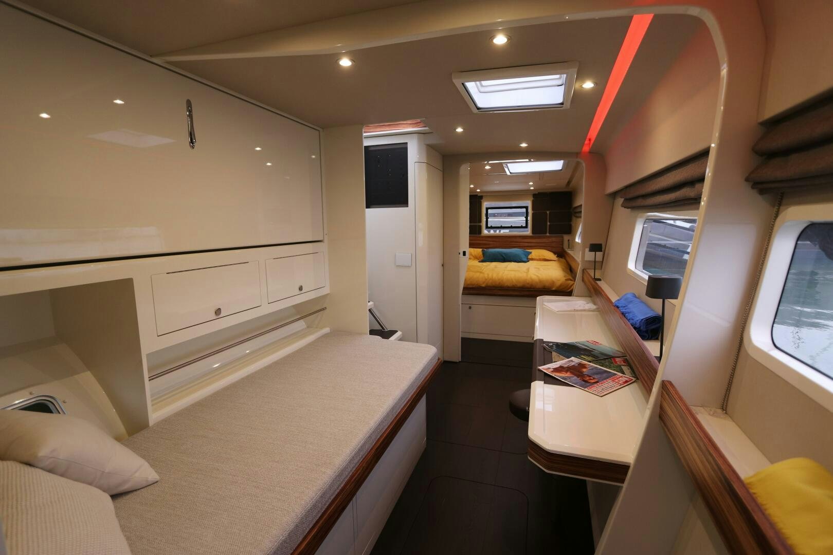 a room with a bed and a desk aboard CATCH ME Yacht for Sale