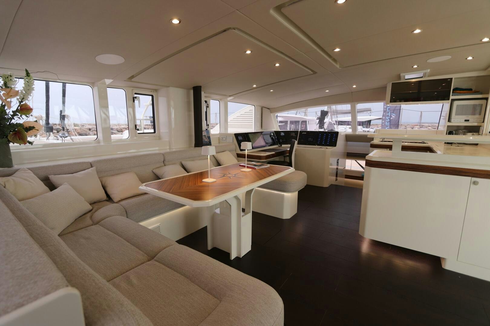 a living room with a couch and a table aboard CATCH ME Yacht for Sale