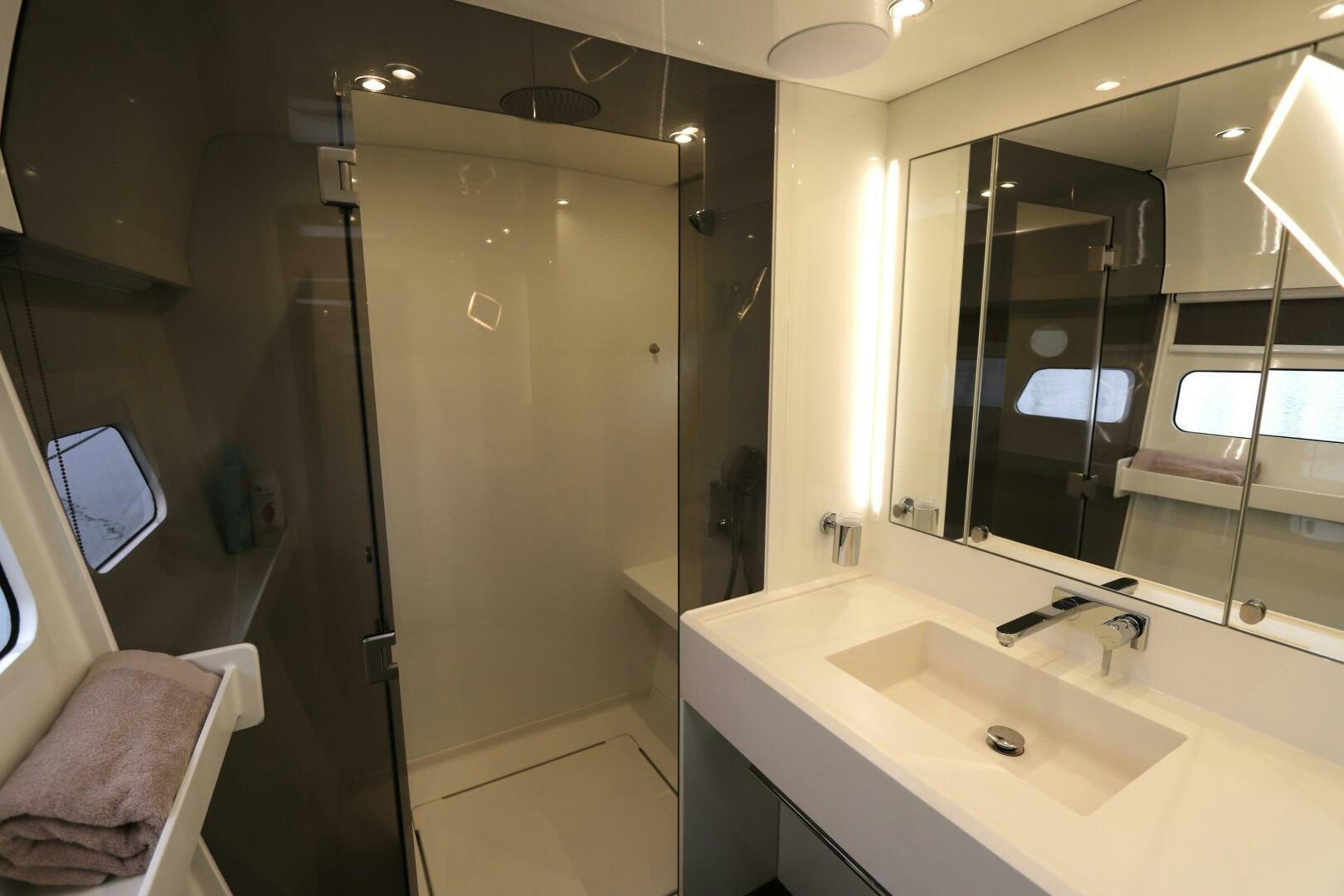 a bathroom with a large mirror aboard CATCH ME Yacht for Sale