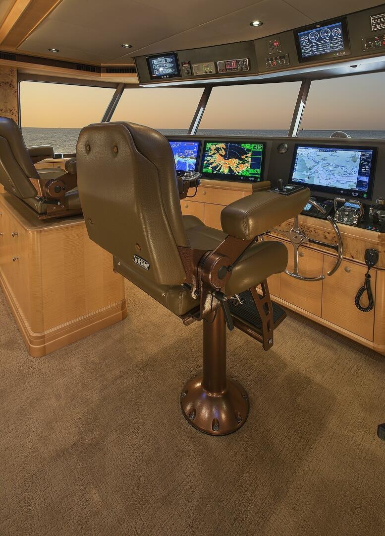 a chair in a room aboard CAZADOR Yacht for Sale