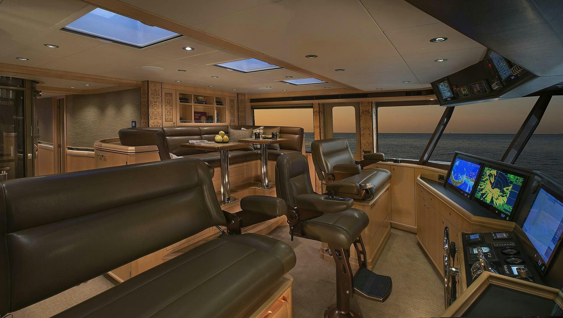 a room with a couch and a tv aboard CAZADOR Yacht for Sale