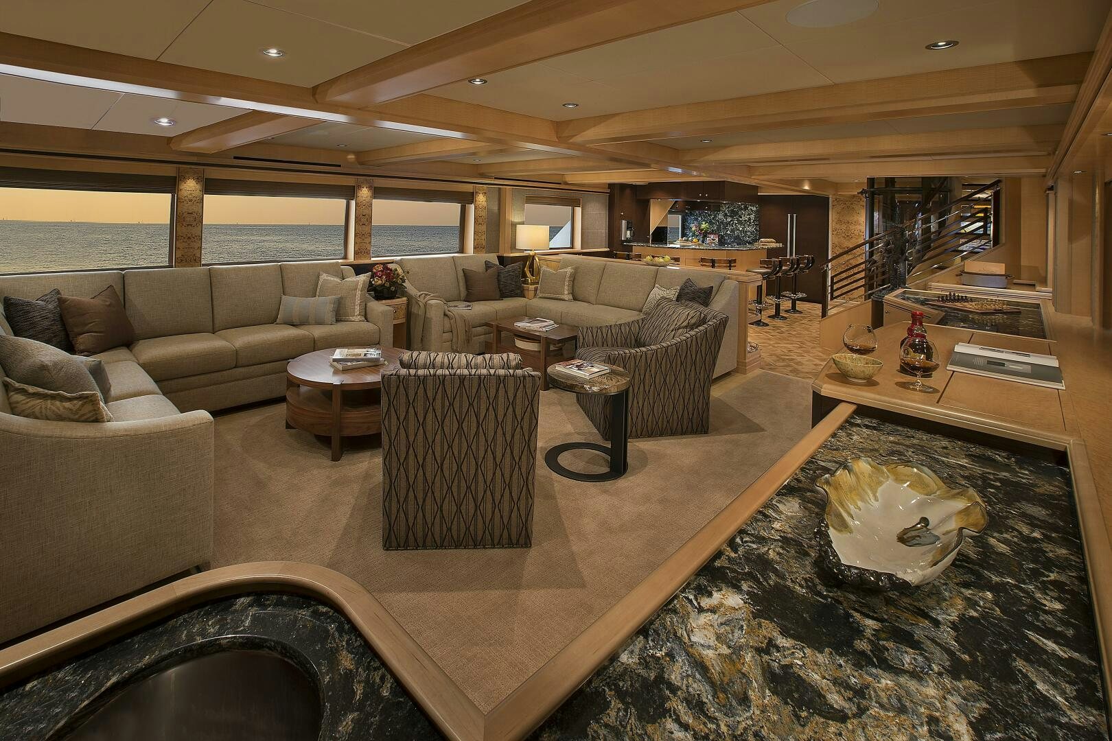 a living room with a large window aboard CAZADOR Yacht for Sale
