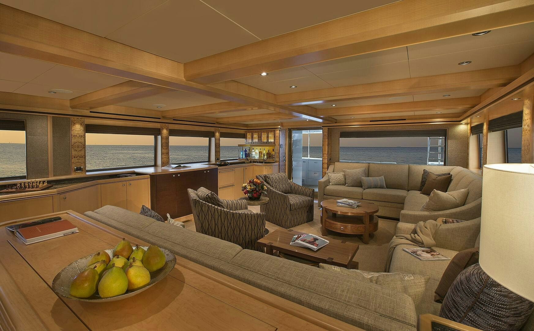 a living room with a large window aboard CAZADOR Yacht for Sale