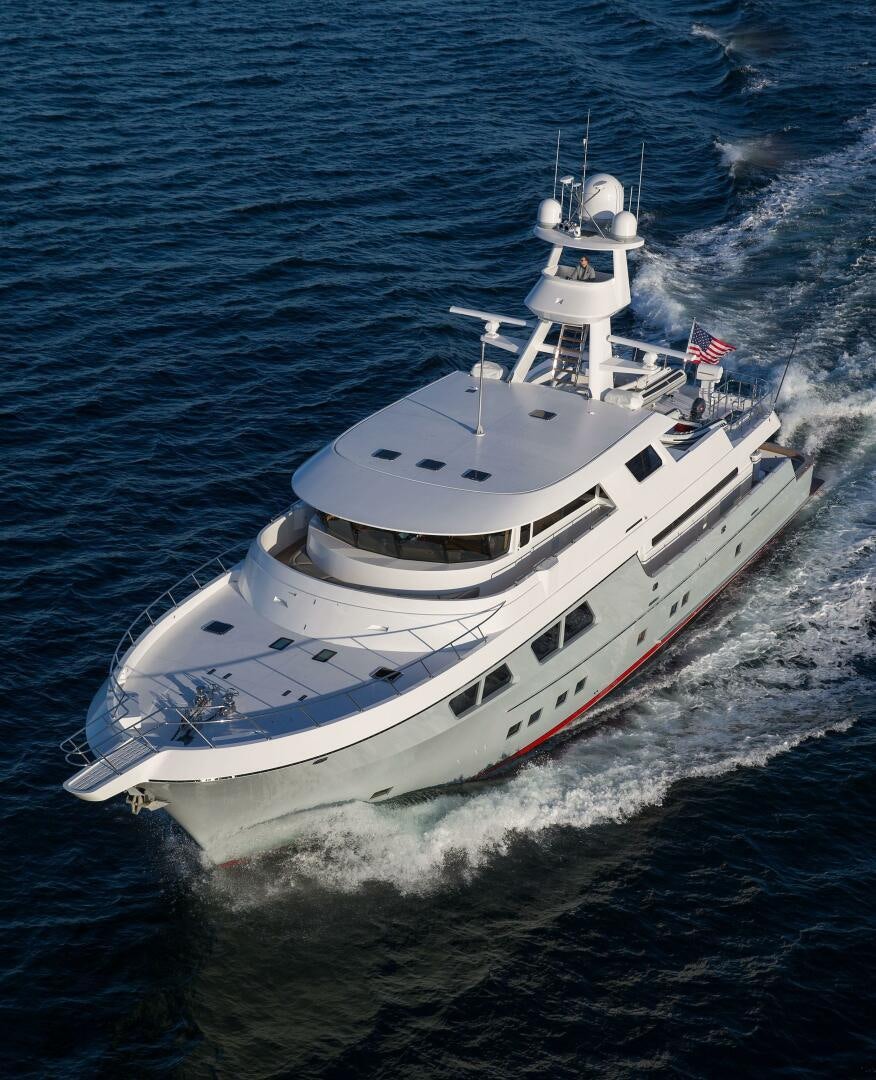 a large white ship in the water aboard CAZADOR Yacht for Sale