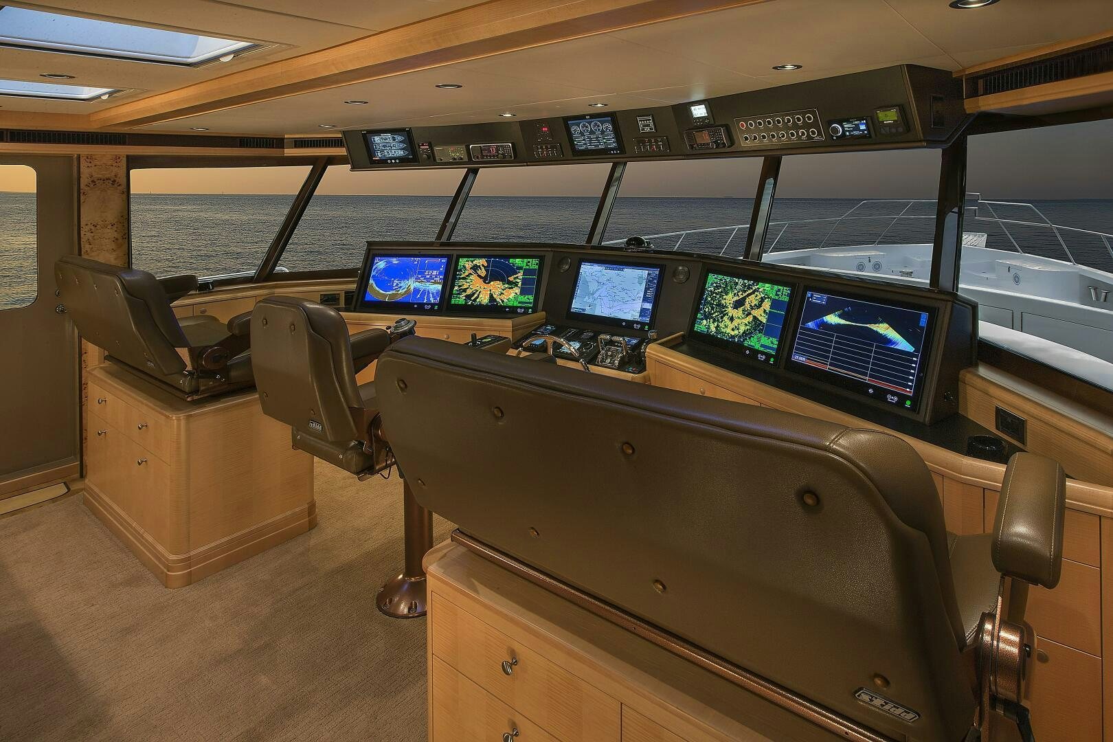 a row of computers on a table aboard CAZADOR Yacht for Sale