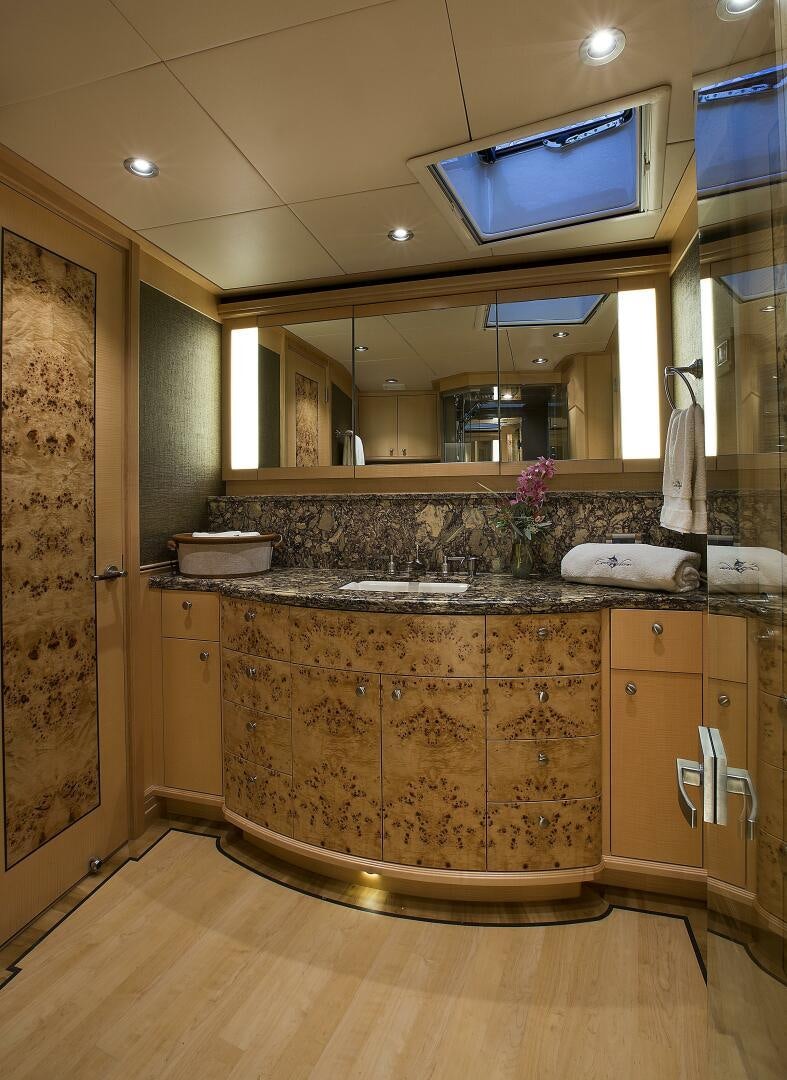 a kitchen with a large mirror aboard CAZADOR Yacht for Sale