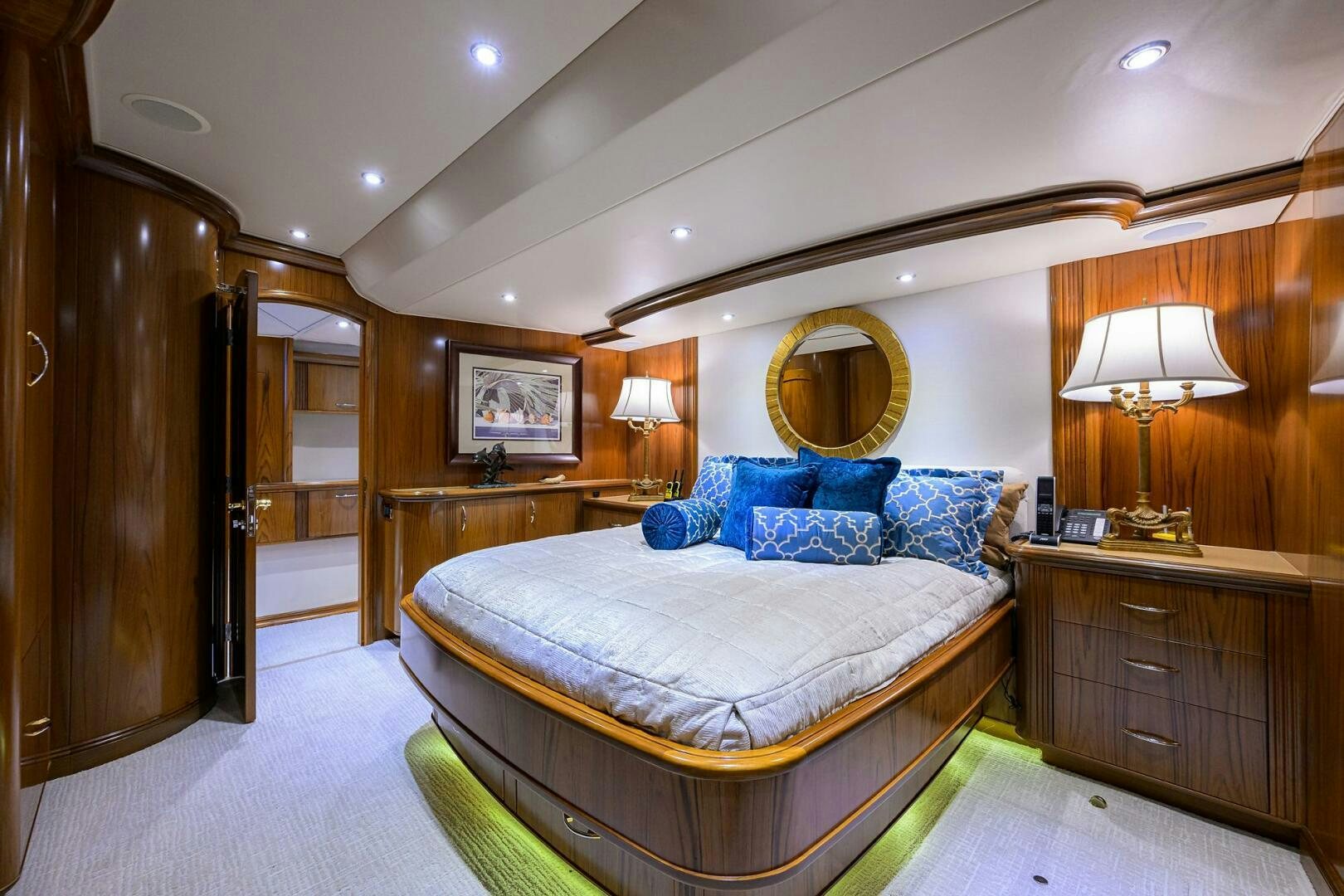 a bedroom with a large bed aboard JR Yacht for Sale
