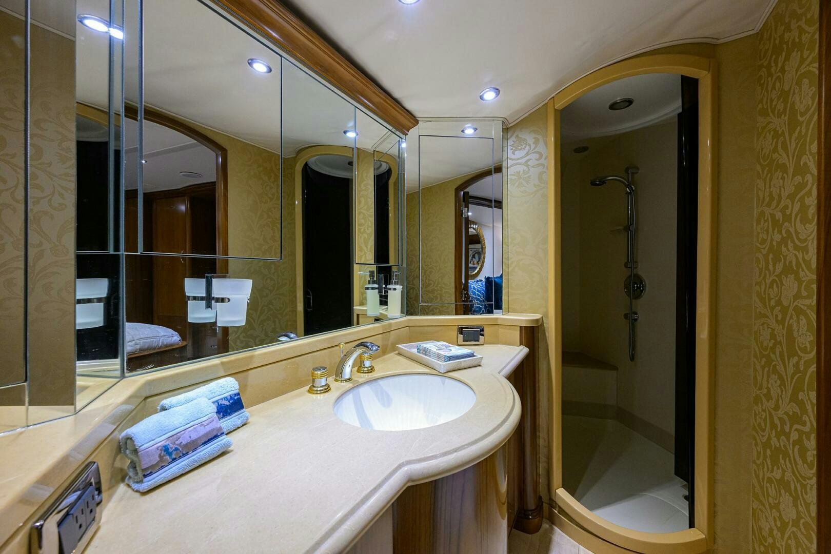 a bathroom with a large mirror aboard JR Yacht for Sale