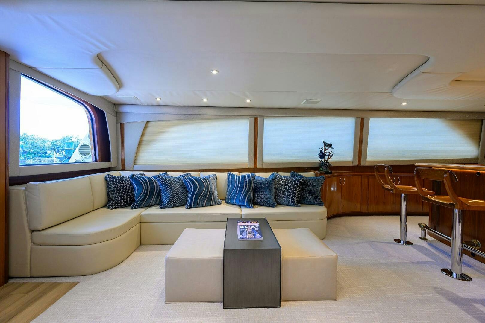 a living room with a couch and a coffee table aboard JR Yacht for Sale