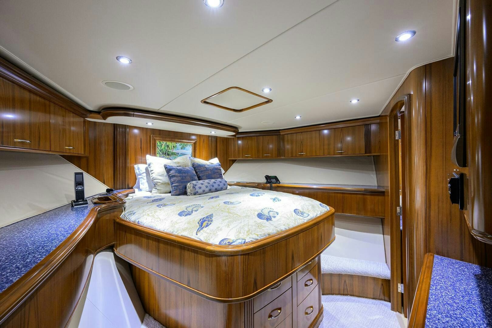 a bedroom with a wood wall aboard JR Yacht for Sale